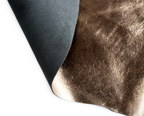 Dark brown shiny leather  texture on white background, close up