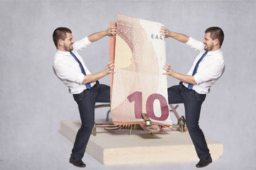 two businessmen fighting for money