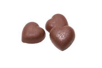 Three chocolate heart candy on white background