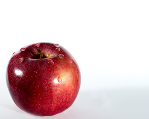 Red juicy apple with dewdrops