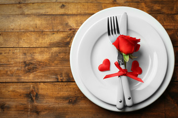 Festive table setting for Valentines Day on wooden table background