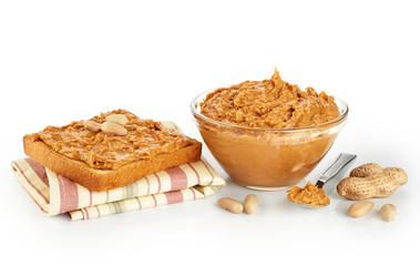 Bowl and toast with peanut butter isolated on white background.