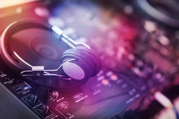 Fototapeta na wymiar DJ mixer with headphones closeup