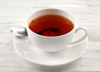 Cup of tea on white table, closeup