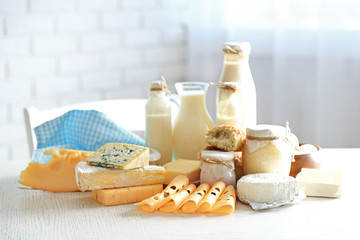 Set of fresh dairy products on white wooden table