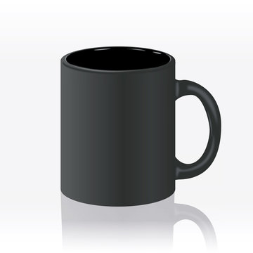 Template ceramic clean black mug with a matte effect, without the bright glare, isolated on a white background. Empty blank for coffee or tea.