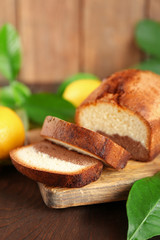 Delicious sweet cake bread on wooden table closeup