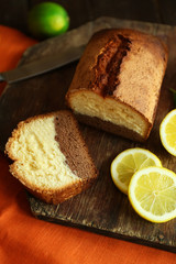 Delicious sweet cake bread on wooden cutting board closeup
