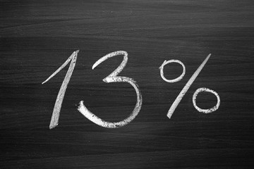 13 percent header written with a chalk on the blackboard
