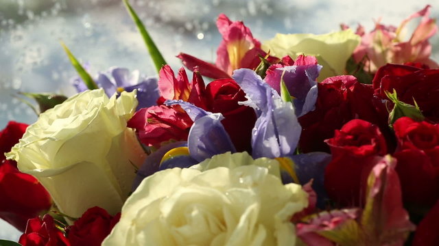 Beautiful bouquet roses, iris and alstroemeria rotates.