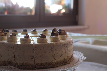 Walnut stracciatella cake in front of window