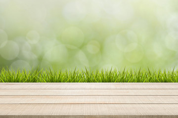 wood table top panel and grass on green background