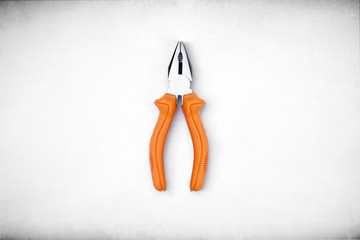 top view of wire cutter with orange color handle which on off-wh