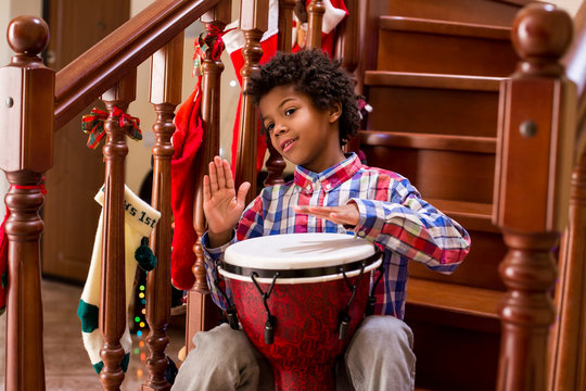 Friendly Afro Child With Drum.