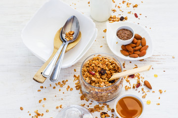 Homemade muesli, honey, nuts and milk. healthy breakfast concept