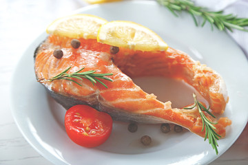 Fish with vegetables on plate
