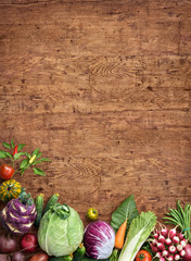 Healthy food background. Studio photo of different fruits and vegetables on rustic wooden table. High resolution product.