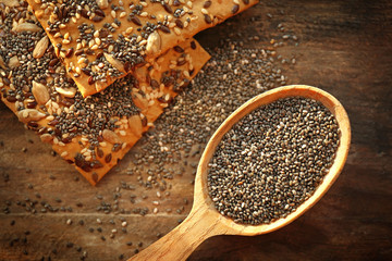 Biscuits with chia seeds on wooden background