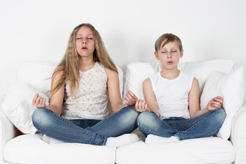 Boy and girl meditate