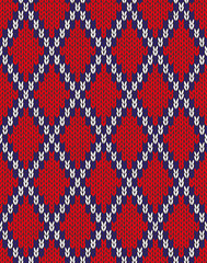 Fototapeta premium Knit woolen seamless jacquard ornament texture. Fabric Red White