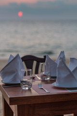 Dinner table set on the beach