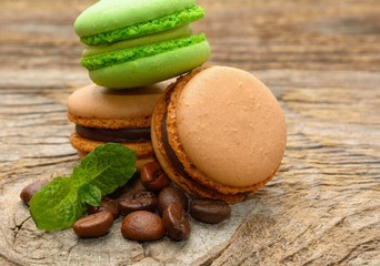 French macaroons with coffee beans and mint leaves