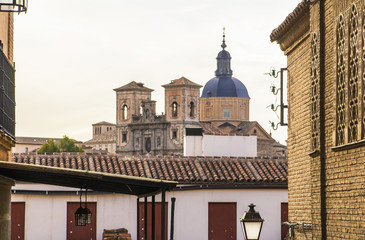 background landscape view of the street and a beautiful church in Toledo at sunset, Spain