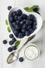 Healthy breakfast of muesli, berries with yogurt and seeds