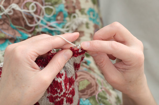 woman hands needle knitting