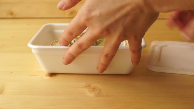 Female hand open box of instant noodles and seasoning take out