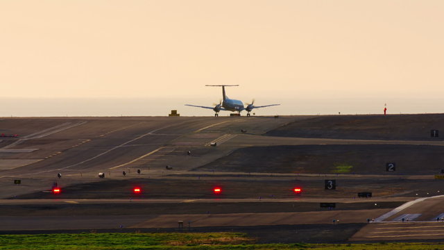 Propeller Plane Taxing On Runway at Dusk - Southern California