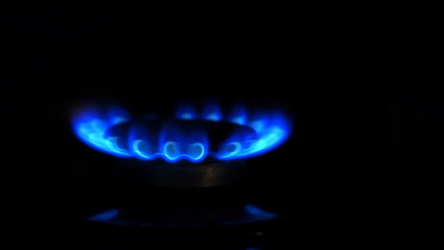Natural gas inflammation from kitchen stove, dark shot