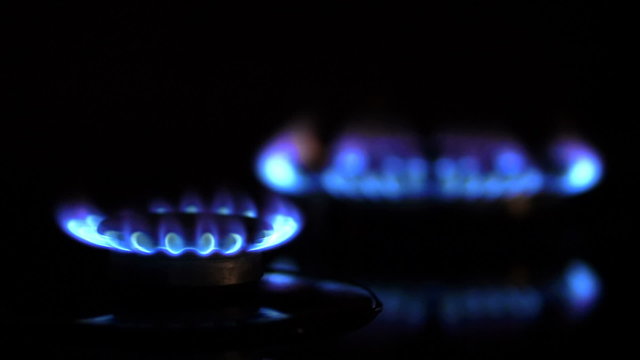 Close up of two gas burners, focusing from one to another