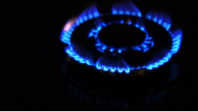 Natural gas inflammation from kitchen stove, dark shot