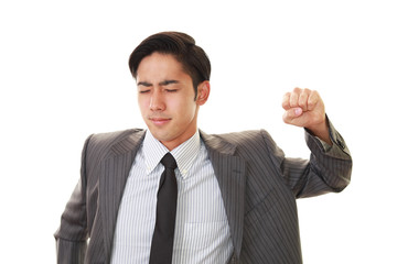 疲れた表情のビジネスマン