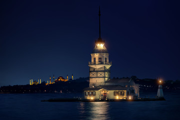 Maiden's Tower in Istanbul at night with Hagia Sophia and The Blue Mosque on the background