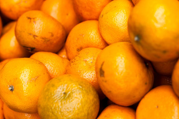 A lot of juicy mandarin oranges. Bunch of fruits. Vivid colours. 