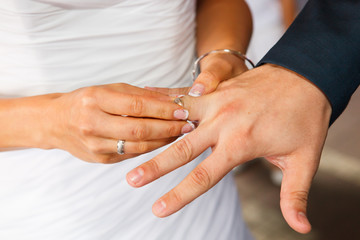 Obraz na płótnie Canvas Bride and groom with wedding rings
