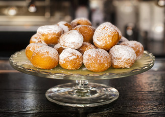 Small donuts on a cake stand