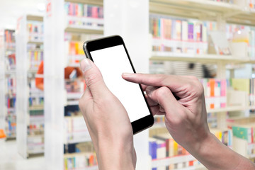 One using smartphone in library