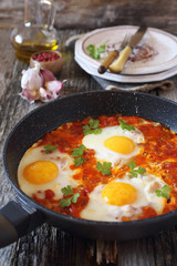 Shakshouka: fried eggs with tomatoes and peppers