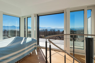 Interior, bright bedroom of a duplex,