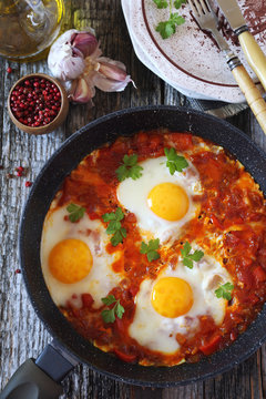Shakshouka: fried eggs with tomatoes and peppers