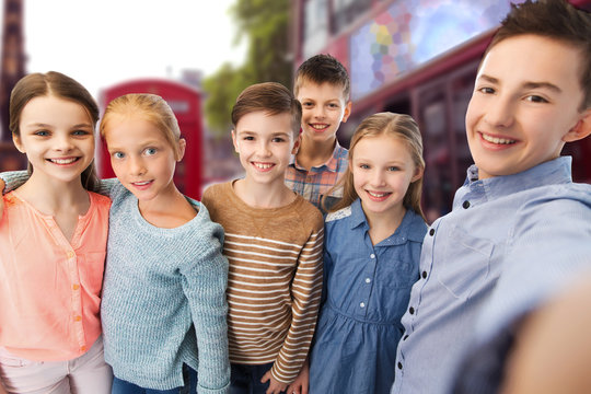 happy children talking selfie over london city