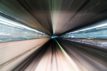 Light trail accelerating through a tunnel