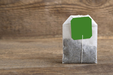 Teabag on wooden background