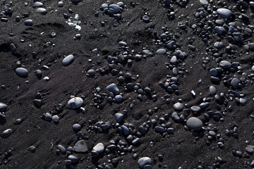 Stone structure at a black sand beach