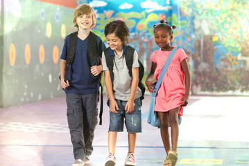 Happy children at school. Multi race classroom enjoying life. In