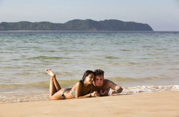 couple man and woman on the beach in summer