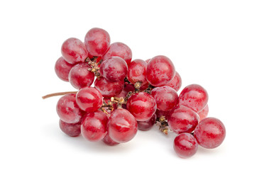 close up of red grape isolated white background